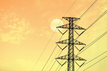 electric pole high voltage transmission tower and lines. Sky sunset background.