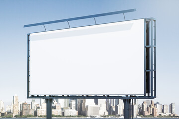 Blank white billboard on cityscape background at daytime, perspective view. Mock up, advertising concept
