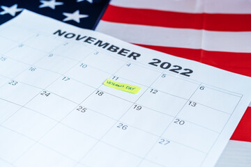 Veteran's Day calendar with the U.S. flag in the background. High quality photo