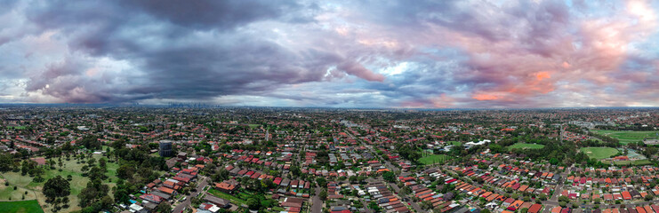 Panoramic Aerial Drone view of Suburban Sydney housing, roof tops, the streets and the parks