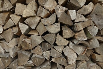 Pile of chopped firewood as background, closeup