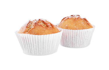 Tasty muffins powdered with sugar on white background