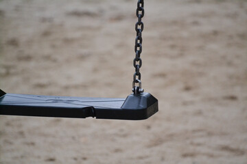 Empty swing on children playground