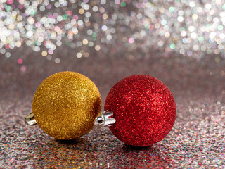 Christmas balls on a silvery background. Christmas decoration with beautiful bokeh.
