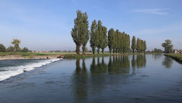 landscape with trees and water, Adda river, Italy