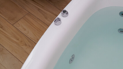 Hot tub with clean water in bathroom
