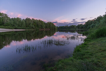 Fototapeta na wymiar may sunset on the river