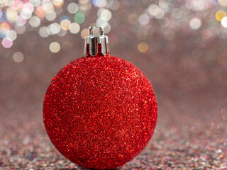 Christmas balls on a silvery background. Christmas decoration with beautiful bokeh.