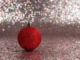 Christmas balls on a silvery background. Christmas decoration with beautiful bokeh.