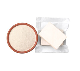 Compressed and granulated yeast on white background, top view