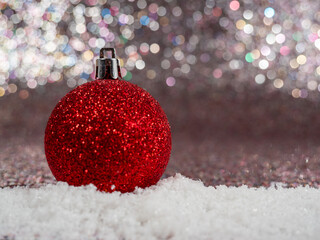 Christmas balls on a silvery background. Christmas decoration with beautiful bokeh.