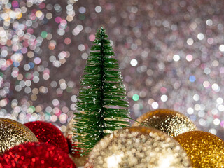 Christmas balls on a silvery background. Christmas decoration with beautiful bokeh.