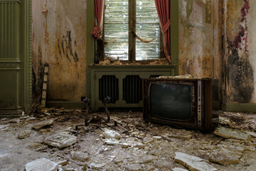 Lost room with an old television covered in dust