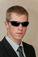 portrait of a businessman in dark sunglasses, isolated