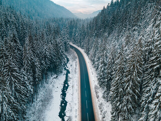 aerial view of road in winter carpathian mountains