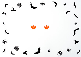 Halloween concept. Halloween paper decorations on white background. Greeting or invitation card. Flat lay style with copy space. Top view