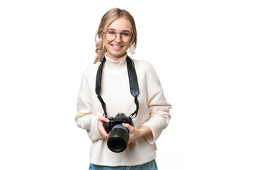 Young photographer English woman over isolated background keeping the arms crossed in frontal...
