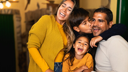 Happy Hispanic family having fun together - Powered by Adobe