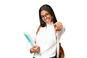 Young African American student woman over isolated background pointing front with happy expression - obrazy, fototapety, plakaty