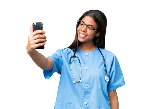 Young African american nurse woman over isolated background making a selfie