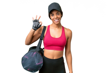 Young sport African american woman with sport bag over isolated background showing ok sign with fingers