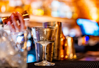 empty glass on a bar counter in bar or pub