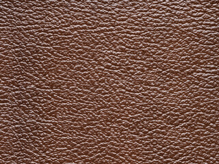 Genuine brown leather, skin natural with design lines pattern or red abstract background. Genuine leather texture. Can use wallpaper or backdrop luxury event, design upholstered furniture, clothing.