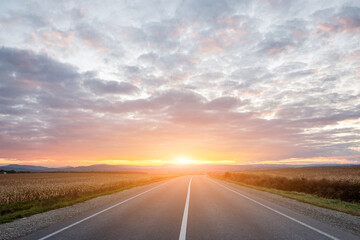 empty asphalt road in sunset time with magic sky