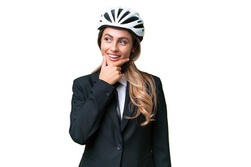 Business Uruguayan woman wearing a helmet biker over isolated background looking to the side