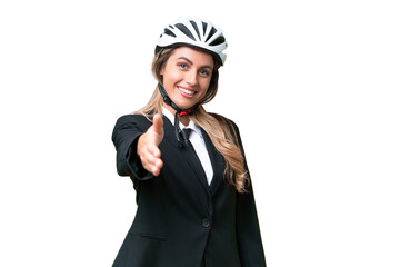 Business Uruguayan woman wearing a helmet biker over isolated background shaking hands for closing a good deal