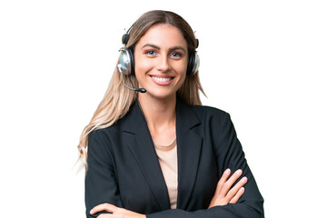 Telemarketer pretty Uruguayan woman working with a headset over isolated background keeping the...