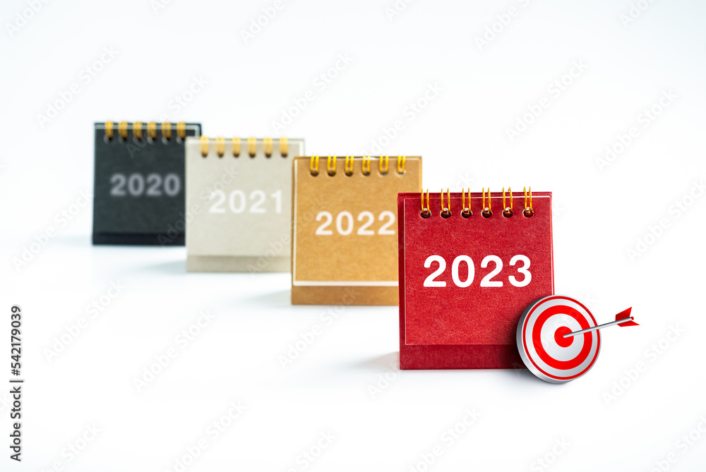 Aufkleber 2023 new year number with 3d target icon on desk calendar cover standing in front of previous years 