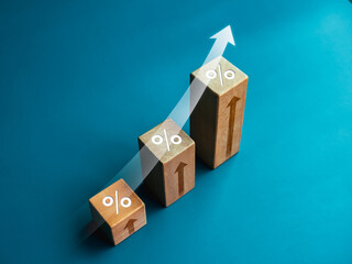 Shining rise up arrow with percentage icon on wooden blocks, 3d bar graph chart steps on blue...