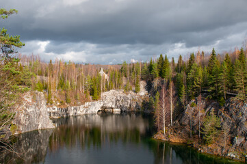 Autumn forest by a mountain lake. Northern landscape