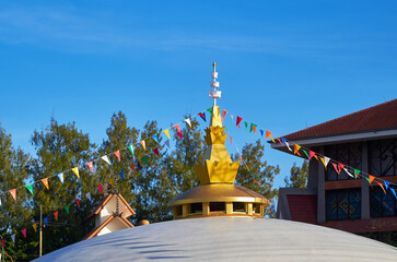 Colorful flag of Buddhism at the golden pagoda