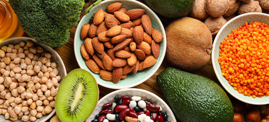 Healthy products on wooden table, top view