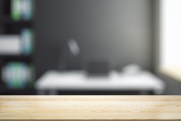 Empty office wooden table with empty space on modern workplace with computer background, closeup, mock up