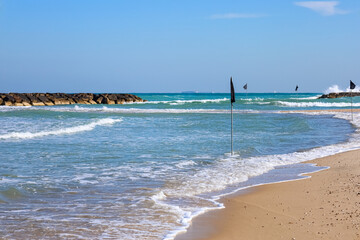 View of beautiful sea and black flags