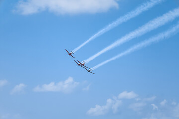 Modern airplanes flying in blue sky