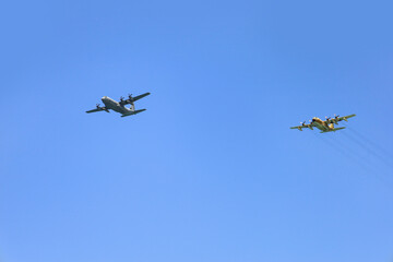 Modern airplanes flying in blue sky