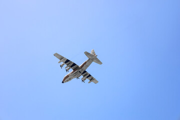 Modern airplane flying in blue sky