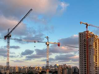 Construction sites and cranes on sky background