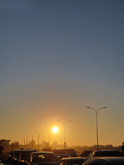 Hot Summer. Sunset over the road with cars. Feeling warm and summer