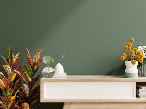 Green wall panelling with wooden cabinet in kitchen room.