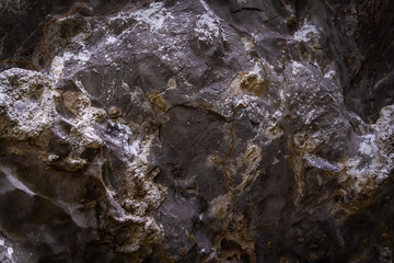Beautiful texture of dark stone background in the cave