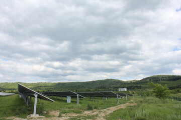Fototapeta premium Sun Above the Solar Farm photovoltaic