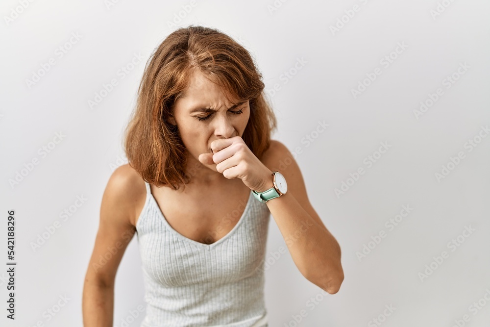 Sticker beautiful caucasian woman standing over isolated background feeling unwell and coughing as symptom f