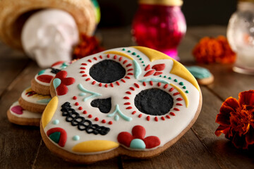 Skull shaped cookies on wooden background, closeup. El Dia de Muertos