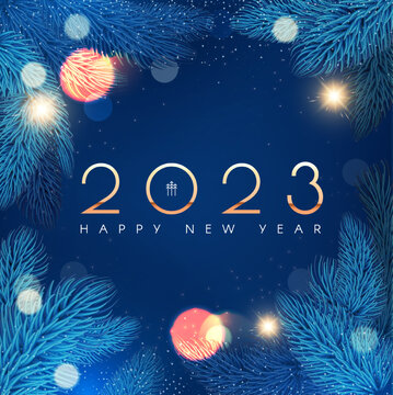 Happy new 2023 year Elegant gold text with fir tree branches and light effects.