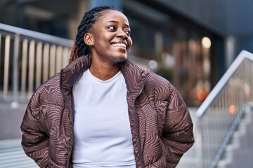 Fototapeta premium African american woman smiling confident looking to the side at street